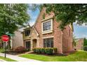 Charming brick home with manicured lawn and mature trees, set in a desirable neighborhood near Windward Ridge Drive at 13042 Dartmore Ave, Alpharetta, GA 30005