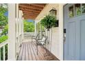 Cozy covered front porch, adorned with plants and seating, provides a relaxing welcome at 1160 Foster Nw Pl, Atlanta, GA 30318