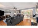 Cozy living room featuring a fireplace, hardwood floors, and comfortable seating at 47 Glen Ridge Dr, Villa Rica, GA 30180