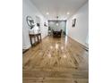 Dining area showcases stylish wainscoting and hardwood floors for an elegant design at 128 Golden Hills Dr, Woodstock, GA 30189