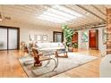 Inviting living room featuring an open layout, skylights, hardwood flooring, and stylish furniture at 1933 Mclendon Ne Ave # A, Atlanta, GA 30307