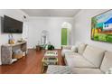 Open-concept living area features hardwood floors and neutral paint at 3777 Peachtree Ne Rd # 1112, Brookhaven, GA 30319