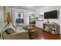 Inviting living room with hardwood floors, neutral decor, and lots of natural light at 3777 Peachtree Ne Rd # 1112, Brookhaven, GA 30319
