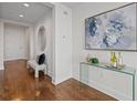 Elegant entryway with hardwood floors, a stylish console table, and tasteful decor for a welcoming ambiance at 3630 Peachtree Ne Rd # 2408, Atlanta, GA 30326