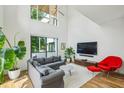 Bright living room featuring hardwood floors, large windows, and comfortable seating at 536 Highland Ne Ave # A, Atlanta, GA 30312