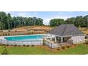 Community pool with an outdoor pavilion, perfect for relaxing on a hot summer day at 1410 Aura Ln, Lawrenceville, GA 30045