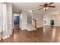 Bright living room features hardwood floors, stairs, and neutral paint at 233 Oakridge Se Dr, Cartersville, GA 30121