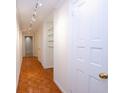 Bright hallway featuring hardwood floors and recessed lighting at 2734 Peachtree Nw Rd # C-404, Atlanta, GA 30305