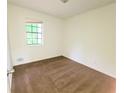 Neutral bedroom with carpet and a window providing natural light at 1225 Creek Forest Nw Ct, Conyers, GA 30012