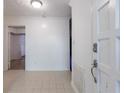 Bright foyer with tiled floors and an open doorway leading to other rooms at 838 Lake Hollow Sw Blvd, Marietta, GA 30064