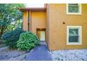 Charming front entrance with a well-lit doorway and manicured shrubbery at 838 Lake Hollow Sw Blvd, Marietta, GA 30064