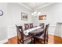 Elegant dining area featuring a large table, hardwood floors, and soft, neutral wall colors at 2300 Peachford Rd # 2404, Atlanta, GA 30338