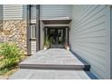 Beautiful tiled front entrance with double doors, dark trim and stone accents at 545 Matterhorn Way Way, Alpharetta, GA 30022