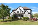 Beautiful home with a well-maintained lawn, stone accents, and a mix of white and gray exterior paint at 1186 Lincoln Dr, Marietta, GA 30066