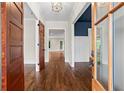 Inviting foyer showcases gleaming hardwood floors and a glimpse into other rooms at 2493 Oostanaula Ne Dr, Brookhaven, GA 30319