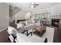 Inviting living room featuring a fireplace, plush seating, and an open floor plan at 5147 Manerdale Se Dr # 5, Vinings, GA 30339