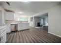 Bright kitchen featuring quartz countertops, stainless appliances, and stylish flooring at 621 Lakewater View Dr, Stone Mountain, GA 30087