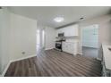 Modern kitchen with stainless appliances and newly installed flooring at 621 Lakewater View Dr, Stone Mountain, GA 30087