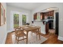 Cozy dining area next to the kitchen and featuring French doors to the backyard at 821 Erin Sw Ave, Atlanta, GA 30310
