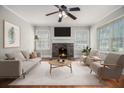 Bright living room featuring hardwood floors, a decorative fireplace, and neutral decor at 821 Erin Sw Ave, Atlanta, GA 30310