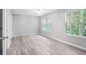 A bedroom with light gray walls, a ceiling fan and light gray flooring at 6947 Gallant Se Cir # 10, Mableton, GA 30126