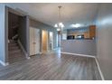 Open-concept living room with modern flooring and neutral color scheme at 7432 Battlecreek Ln, Jonesboro, GA 30236