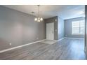 Well-lit living room showcasing neutral walls, modern flooring, and natural light at 7432 Battlecreek Ln, Jonesboro, GA 30236