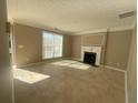 Bright living room featuring tile floors and a fireplace with decorative mantel at 3116 Leyland Ct, Decatur, GA 30034