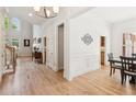 Spacious living area with high ceilings, hardwood floors, large windows, and ample natural light at 952 Moores Walk Ln, Suwanee, GA 30024