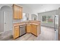 Kitchen area with stainless steel appliances, wood cabinets, breakfast bar and wood flooring at 181 Ridgemont Rd, Canton, GA 30114