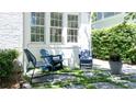 Inviting outdoor seating area with stylish chairs and stone pavers, perfect for relaxing at 204 Rumson Ne Rd, Atlanta, GA 30305