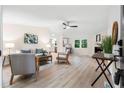 Bright living room features a fireplace, hardwood floors, and stylish contemporary furniture at 1010 Martin Ln, Canton, GA 30114