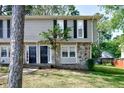 Charming two-story home featuring stone accents, dark shutters, and a neatly kept front yard at 1142 Forest Villa Nw Dr, Conyers, GA 30012