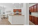 Open kitchen features granite countertops, stainless appliances, and a breakfast nook at 303 Ridgewood Trl, Canton, GA 30115