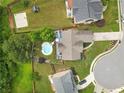 Aerial view of a home showcasing the backyard pool and patio with well-maintained landscaping at 648 York View Dr, Auburn, GA 30011