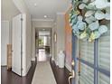 Bright and airy foyer with elegant decor and hardwood flooring at 2075 Parkhaven Ct, Roswell, GA 30076
