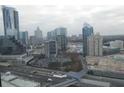 City view featuring high-rise buildings, cloudy skies, and a visible highway at 3445 Stratford Ne Rd # 2703, Atlanta, GA 30326