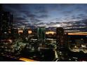 Stunning night view of the city skyline with illuminated buildings and a colorful sunset at 3445 Stratford Ne Rd # 2703, Atlanta, GA 30326