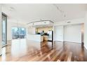 Bright and airy living space featuring hardwood floors and a modern kitchen with stunning city views at 361 17Th Nw St # 1702, Atlanta, GA 30363