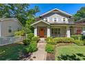 Charming two-story home with inviting front porch and walkway, surrounded by a well-manicured lawn at 629 2Nd Avenue, Decatur, GA 30030