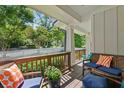 Relaxing covered porch featuring comfortable seating and a view of the landscaped yard at 629 2Nd Avenue, Decatur, GA 30030