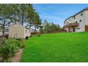 Large backyard features a shed and garden, perfect for outdoor activities and relaxation at 909 Shatley Dr, Stockbridge, GA 30281