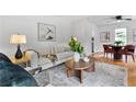 Bright living room featuring modern decor, hardwood floors, and stylish furniture at 1192 Willivee Dr, Decatur, GA 30033