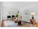 Cozy living room with hardwood floors, comfortable seating, and ample natural light at 1192 Willivee Dr, Decatur, GA 30033