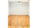 Clean and bright dining room featuring hardwood floors and classic chair rail trim at 654 Continental Dr, Lawrenceville, GA 30044