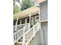 Close up of the front steps and door, showing the house number and charming architectural details at 654 Continental Dr, Lawrenceville, GA 30044
