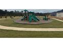 Community playground with a variety of slides, climbing structures, and play equipment at 5370 Tolar Rd, South Fulton, GA 30213