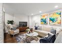 Bright living room showcases a cozy seating area with colorful artwork and a decorative rug at 802 Frederica Ne St # 5, Atlanta, GA 30306