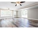 Spacious living room features hardwood floors, large windows, and recessed lighting at 1916 Highway 138 Sw, Conyers, GA 30094