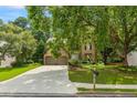 Charming two-story home featuring a well-manicured lawn, beautiful landscaping, and a two car garage at 3570 Bardfield Ct, Cumming, GA 30041